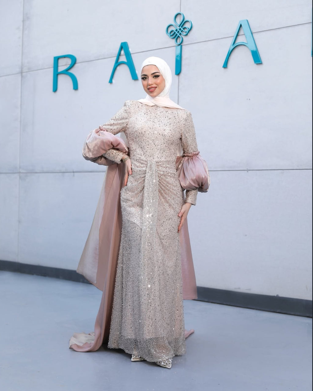 Product photo showing rose Vienna Dress with sparkling decoration, contrast puffed sleeves and gathered front draping