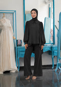 High-Low Pleated Shoulder Chemise in black, with a pointed collar, gathered long sleeves and a high-low hem.
