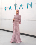Crystal Swirl Gown shown in rose gold, with an embellished bodice, long flared sleeves and a draped skirt.