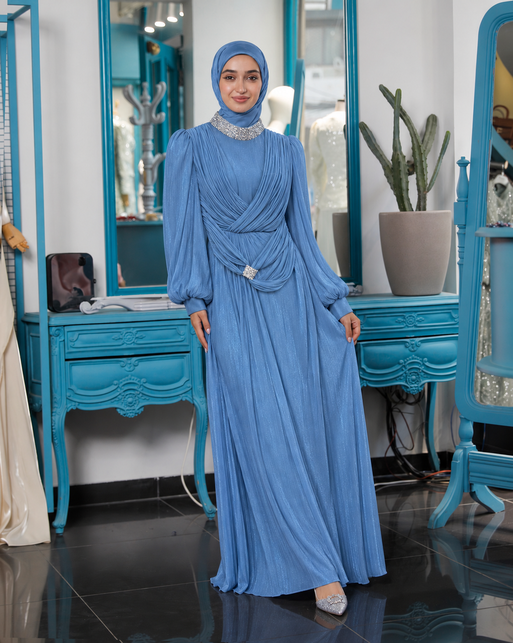 Blue Serena Draped Gown with layered draping and embellishment at the neckline and hip
