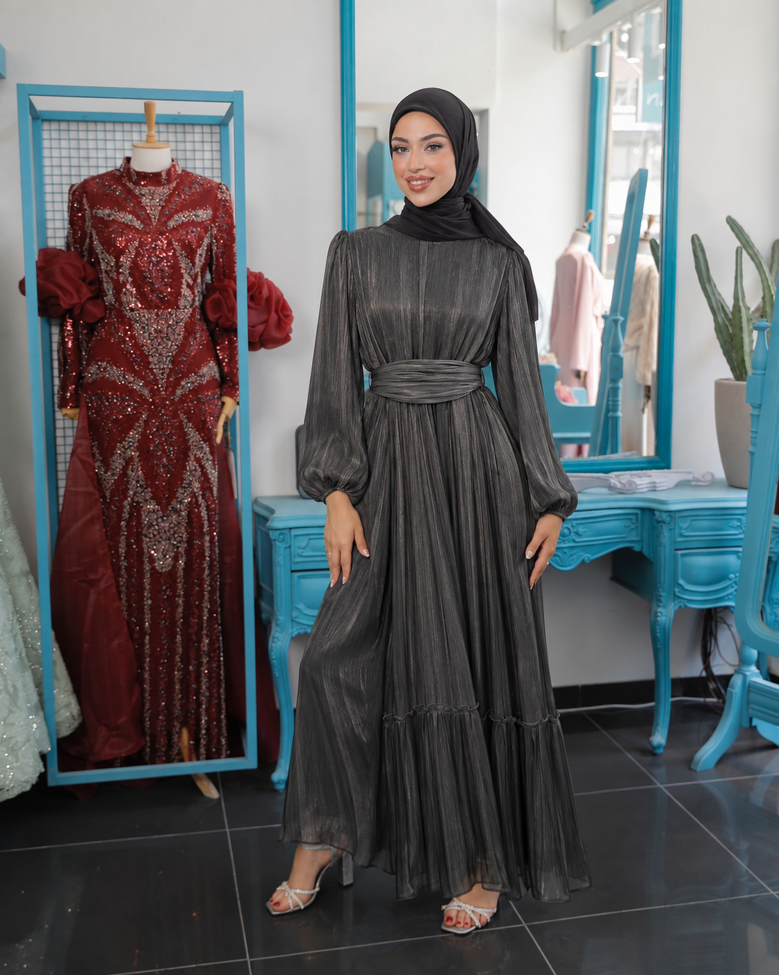 Black Mirella Gown with shimmering texture, gathered sleeves and a tiered skirt hem