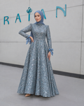 Blue Viviana Dress with a sparkling pattern, wrist bows and a full skirt