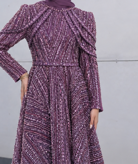 Close-up of Crystal Cascade Gown showing purple gown embellished shoulder drapes and waist seams, cropped from the original product photo.