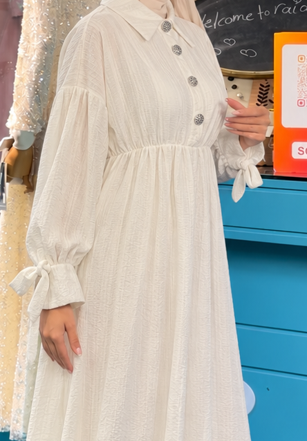 Close-up of Ivory Bow Cuff Dress, cropped directly from the original product photo.